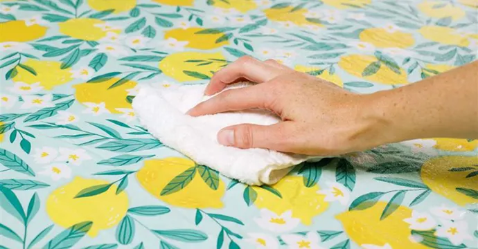 A neatly laid table dressed with a clean, freshly pressed tablecloth