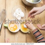mother-child-break-eggs-600w-389674597